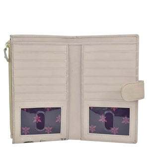 Open Anuschka Cell Phone Case & Wallet - 1113 with card slots and transparent id windows displaying purple floral cards.