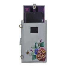 Load image into Gallery viewer, Embroidered genuine leather Cell Phone Case &amp; Wallet - 1113 with floral design by Anuschka, with a phone inserted in the back pocket.
