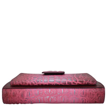 Load image into Gallery viewer, Red embossed genuine leather Anuschka ottoman with a matching cushion on top.
