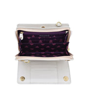 Open empty white Anuschka Organizer Wallet Crossbody - 1149 with RFID protection showing its compartments and purple lining with floral pattern.