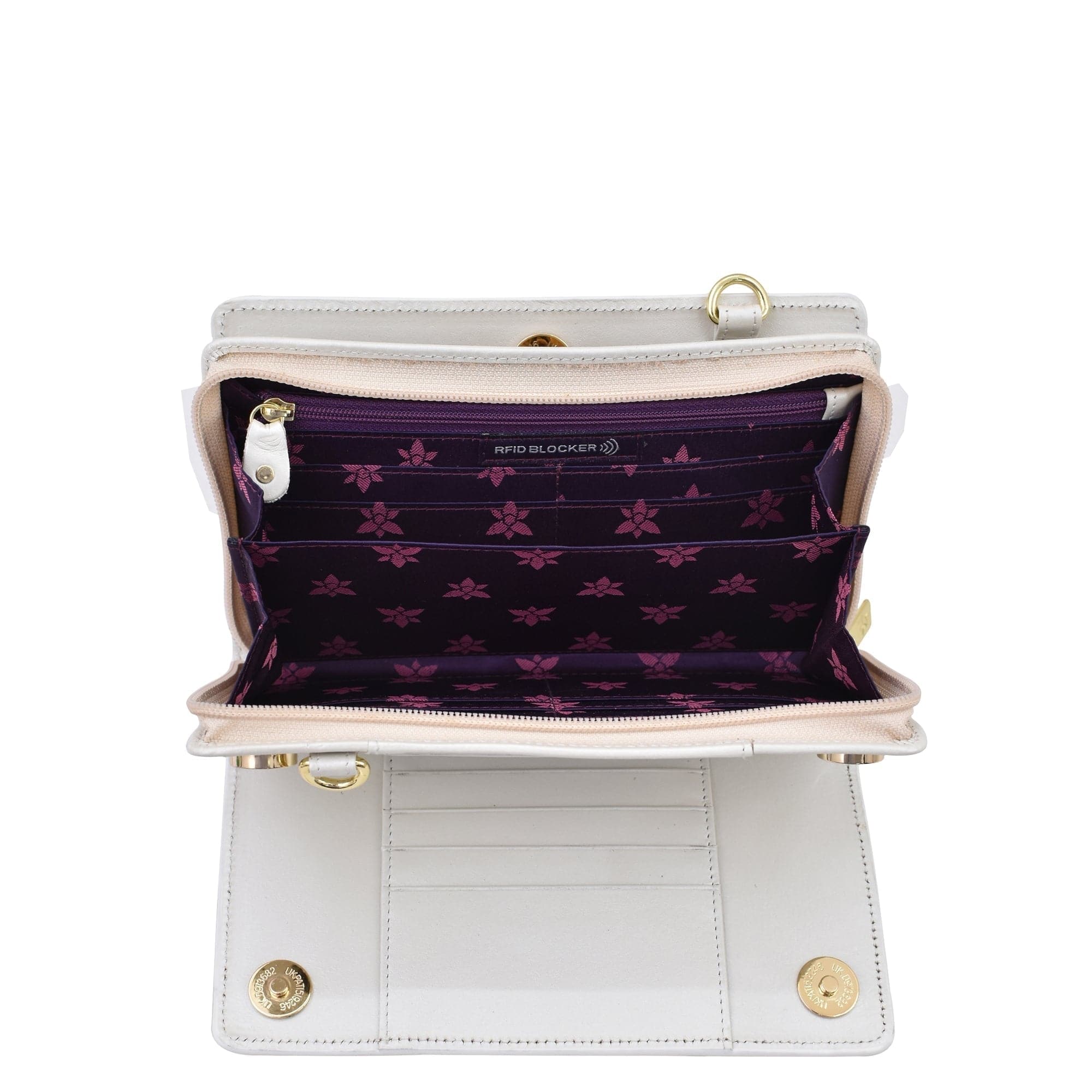 Open empty white Anuschka Organizer Wallet Crossbody - 1149 with RFID protection showing its compartments and purple lining with floral pattern.