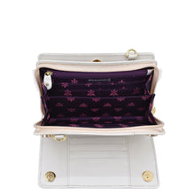 Load image into Gallery viewer, Open empty white Anuschka Organizer Wallet Crossbody - 1149 with RFID protection showing its compartments and purple lining with floral pattern.
