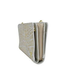 Load image into Gallery viewer, Beige genuine leather crocodile texture wallet with gold-tone hardware and RFID protection against a white background. 
Product Name: Organizer Wallet Crossbody - 1149 by Anuschka.
