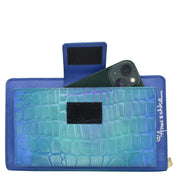 Anuschka Organizer Wallet Crossbody - 1149 with RFID protection, a smartphone, and card holder.