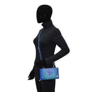 Mannequin with black full-body suit and featureless head, holding a Anuschka Organizer Wallet Crossbody - 1149 with RFID protection.