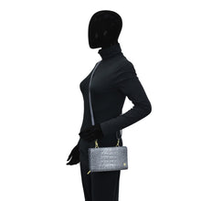 Load image into Gallery viewer, Mannequin displaying a gray Anuschka Organizer Wallet Crossbody - 1149 with a shoulder chain.
