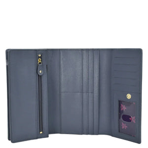 Open Anuschka Three Fold Wallet - 1150 with multiple card slots and a zippered compartment.
