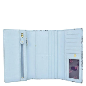 Light blue, Anuschka Three Fold Wallet - 1150 open showing various card slots, a transparent ID window, and a zipped coin compartment.