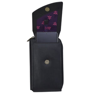 Black genuine leather Crossbody Phone Case - 1173 by Anuschka with a floral interior and a phone partially visible.