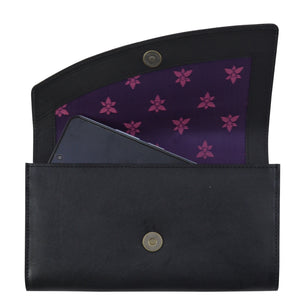 Anuschka Accordion Flap Wallet - 1174 with RFID protection and a floral patterned interior holding a smartphone.