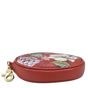 Anuschka Round Coin Purse - 1175 with floral design and gold-colored clasp, isolated on a white background.