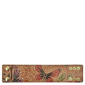 Brown hand-painted, embroidered Anuschka genuine leather wallet with snap fasteners.
