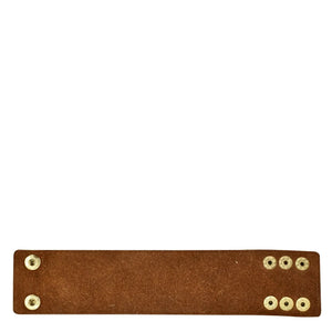 Brown Anuschka genuine leather strap with metal rivets on an isolated background.