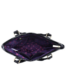 Load image into Gallery viewer, Open Anuschka Fabric with Leather Trim Zip Top City Tote -12005 handbag with a purple interior and a pattern of stars, featuring a zip entry and a leather shoulder strap.
