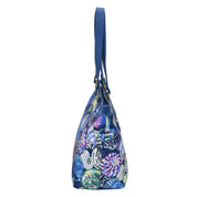 Anuschka Fabric with Leather Trim Zip Top City Tote - 12005 with a leather shoulder strap on a white background.