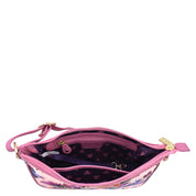 Open Anuschka fabric with leather trim East/West hobo handbag with a visible main compartment and zipper closure.