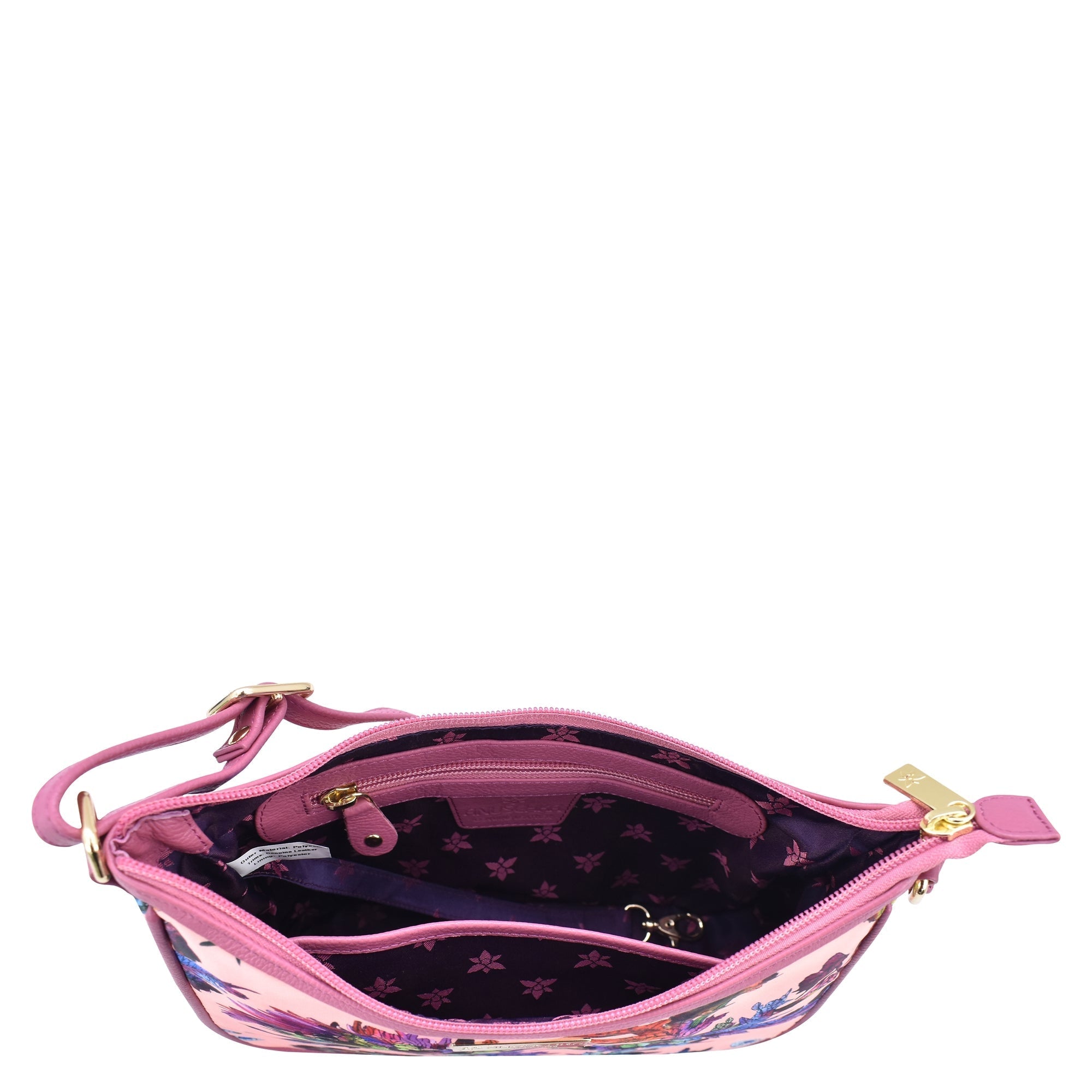 Open Anuschka fabric with leather trim East/West hobo handbag with a visible main compartment and zipper closure.