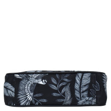Load image into Gallery viewer, Black Anuschka cosmetic bag with white tropical print design, featuring a zippered wall pocket.
