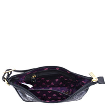 Load image into Gallery viewer, Open Anuschka Fabric with Leather Trim East/West Hobo - 12013 displaying the interior pattern and compartments, including a zippered wall pocket, against a white background.
