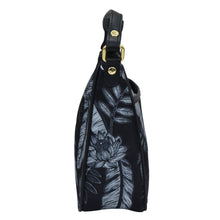 Load image into Gallery viewer, Side view of an Anuschka Fabric with Leather Trim East/West Hobo - 12013 handbag with a floral pattern and an adjustable handle drop.
