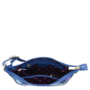 Blue Fabric with Leather Trim East/West Hobo - 12013 handbag with a floral interior design and an adjustable handle on a white background by Anuschka.