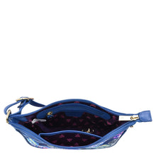 Load image into Gallery viewer, Blue Fabric with Leather Trim East/West Hobo - 12013 handbag with a floral interior design and an adjustable handle on a white background by Anuschka.
