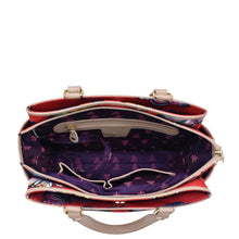 Load image into Gallery viewer, An Anuschka Fabric with Leather Trim Multi Compartment Satchel - 12014 with a patterned interior, multiple compartments, and an adjustable strap.
