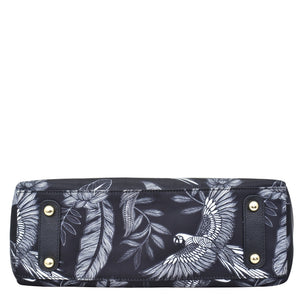 Anuschka navy blue floral-patterned clutch with gold-tone hardware accents and a zippered compartment.