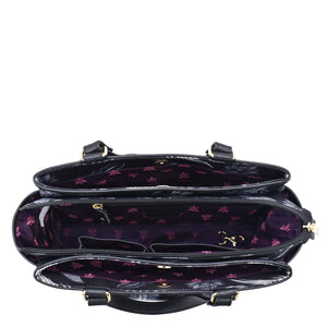 Open Anuschka Fabric with Leather Trim Multi Compartment Satchel - 12014 with a purple interior, a patterned lining, and an adjustable strap.