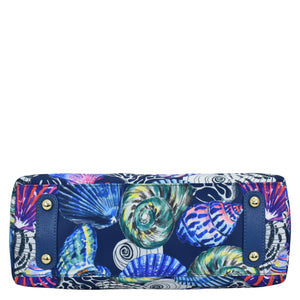 Printed clutch with marine shell design on a white background, featuring a zippered compartment from Anuschka's Fabric with Leather Trim Multi Compartment Satchel - 12014.