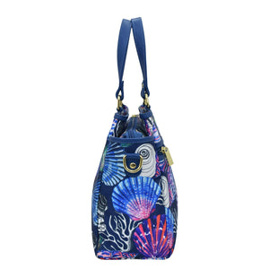 Blue marine-themed shoulder bag with a colorful underwater design featuring an adjustable strap from Anuschka's Fabric with Leather Trim Multi Compartment Satchel - 12014.