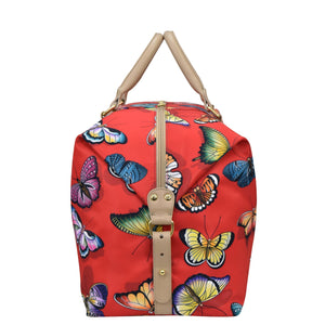 Red tote bag with colorful butterfly print design, tan handles, and a zippered pocket by Anuschka's Fabric with Leather Trim Great Escape Duffle - 12016.