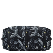 Anuschka Fabric with Leather Trim Great Escape Duffle - 12016 with a white bird and foliage print, featuring a zippered pocket.