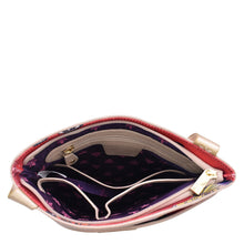 Load image into Gallery viewer, Open empty Anuschka purse viewed from above showing the interior compartments and a rear zippered pocket.
