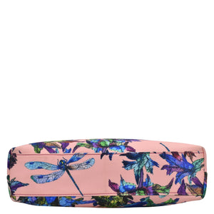 Floral and dragonfly print cosmetic bag with a rear zippered pocket on a white background in Anuschka's Fabric with Leather Trim Crossbody with Slip Pocket - 12017.