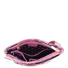 Load image into Gallery viewer, An Anuschka open pink purse with a star-patterned interior and an adjustable handle, isolated on a white background.
