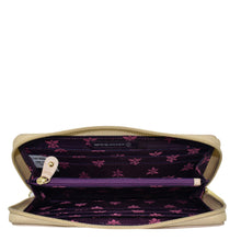 Load image into Gallery viewer, Open Anuschka Fabric with Leather Trim Wristlet Travel Wallet - 13000 revealing card slots and a purple interior with floral pattern, featuring an RFID protected zippered pocket.
