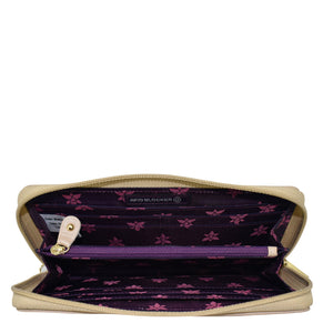 Open Anuschka Fabric with Leather Trim Wristlet Travel Wallet - 13000 revealing card slots and a purple interior with floral pattern, featuring an RFID protected zippered pocket.