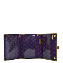 Load image into Gallery viewer, Open Anuschka Fabric with Leather Trim Toiletry Case - 13001 with multiple compartments, zippered pockets, and a purple and gold star pattern.
