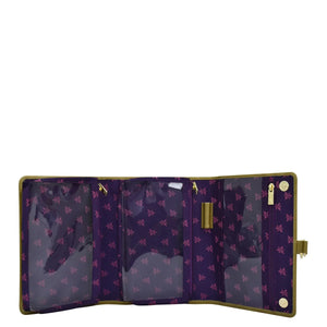 Open Anuschka Fabric with Leather Trim Toiletry Case - 13001 with multiple compartments, zippered pockets, and a purple and gold star pattern.