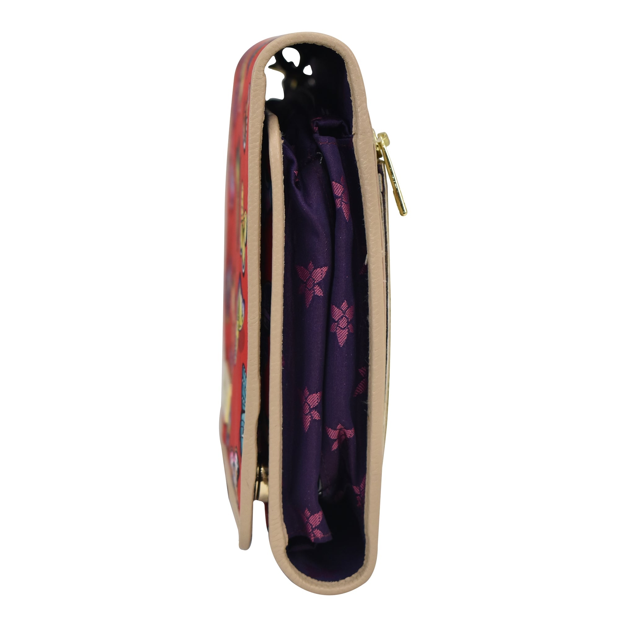 Side view of a partially open, colorful zippered Anuschka toiletry case with leather trim, zippered pockets, displaying its content and lining.