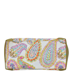 Colorful paisley-patterned Anuschka clutch-style bag with a zip entry on a white background.