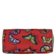 Load image into Gallery viewer, An Anuschka red wallet with a colorful butterfly print design, featuring a full-length pocket and zip entry.
