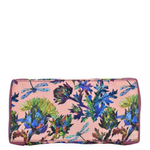 Load image into Gallery viewer, Floral and butterfly print fabric with leather trim dome cosmetic bag - 13002 from Anuschka, with a full-length pocket on a plain background.
