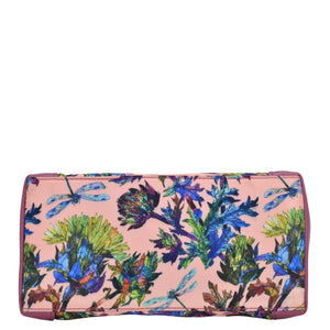 Floral and butterfly print fabric with leather trim dome cosmetic bag - 13002 from Anuschka, with a full-length pocket on a plain background.
