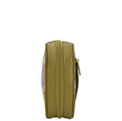 Side view of a closed circular yellow bag with a zippered wall pocket and a zipper, Anuschka Fabric with Leather Trim Travel Jewelry Organizer - 13003.