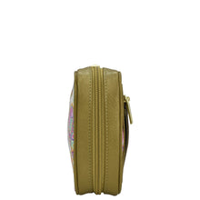 Load image into Gallery viewer, Side view of a closed circular yellow bag with a zippered wall pocket and a zipper, Anuschka Fabric with Leather Trim Travel Jewelry Organizer - 13003.
