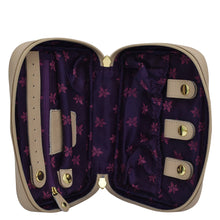 Load image into Gallery viewer, Open Anuschka beige Fabric with Leather Trim Travel Jewelry Organizer - 13003 with purple floral interior and empty compartments.

