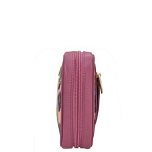 Load image into Gallery viewer, Side view of a closed pink Fabric with Leather Trim Travel Jewelry Organizer - 13003 by Anuschka with multiple zippered pockets.
