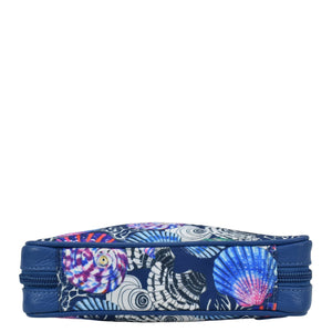 A patterned blue Fabric with Leather Trim Travel Jewelry Organizer - 13003 with zip entry on a white background.